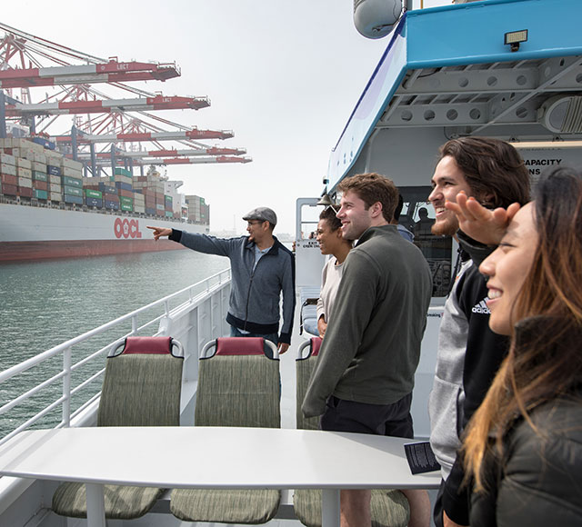 Oxy Economics professor Richard Mora and students at Port of Long Beach