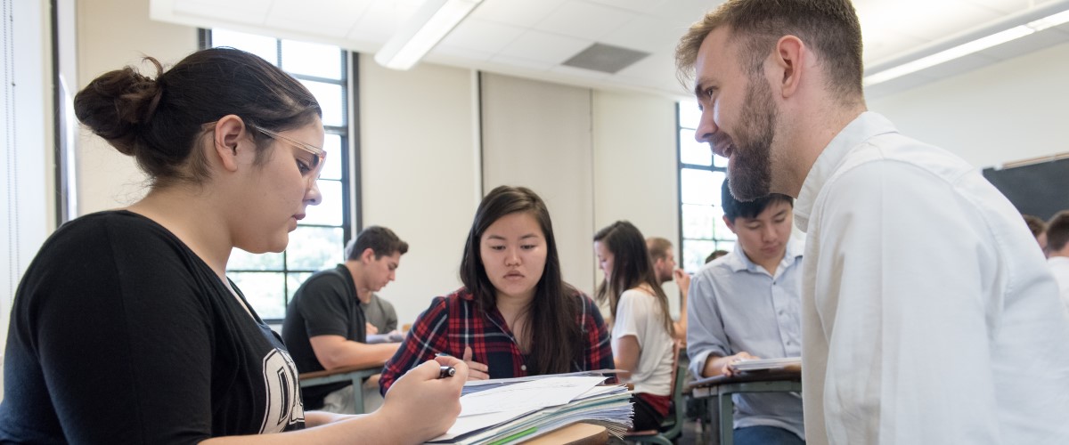 Department of Economics assistant professor Brandon Lehr teaches his class,