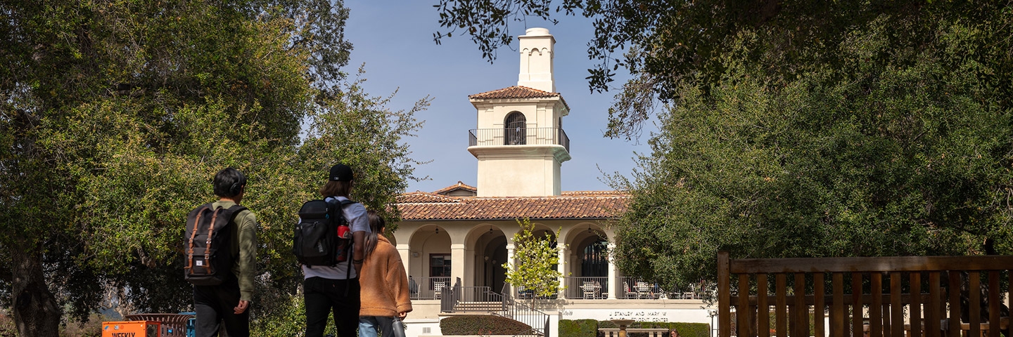 Students walk across the quad in front of Johnson Student Center
